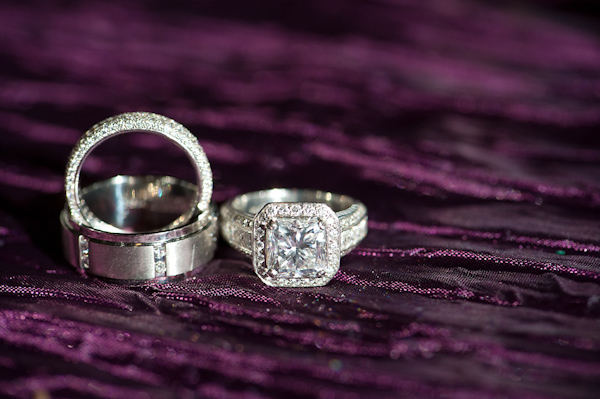 wedding ring display on purple fabric - photo by Houston based wedding photographer Adam Nyholt